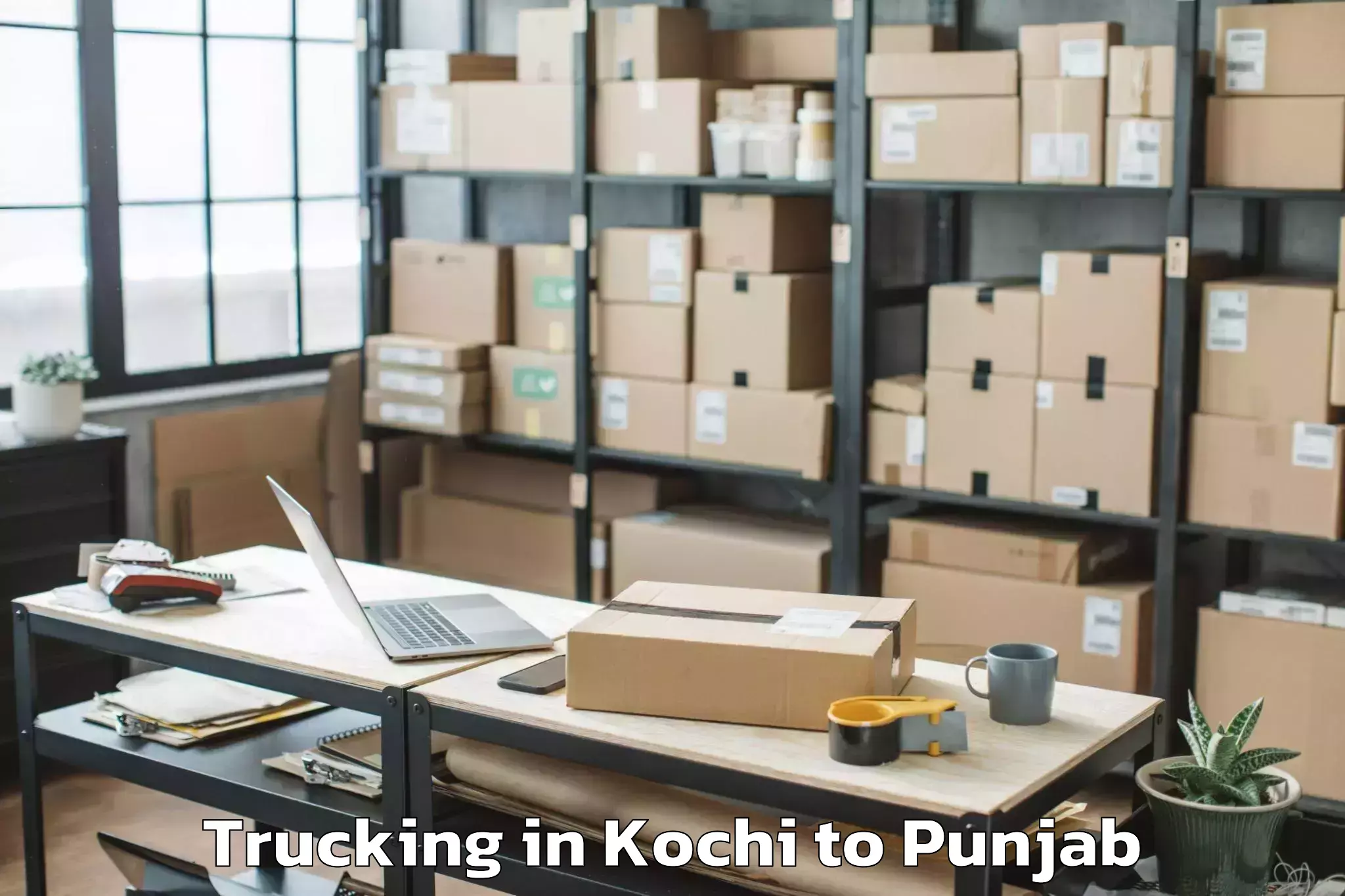 Book Kochi to Moga Trucking